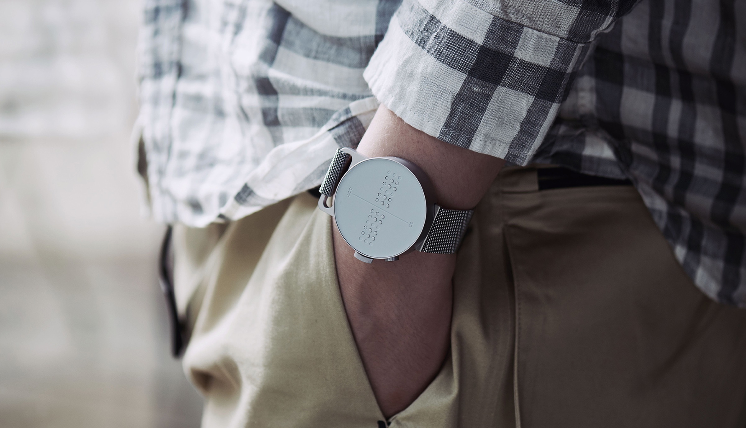 A Male person wearing Dot Watch stylishly